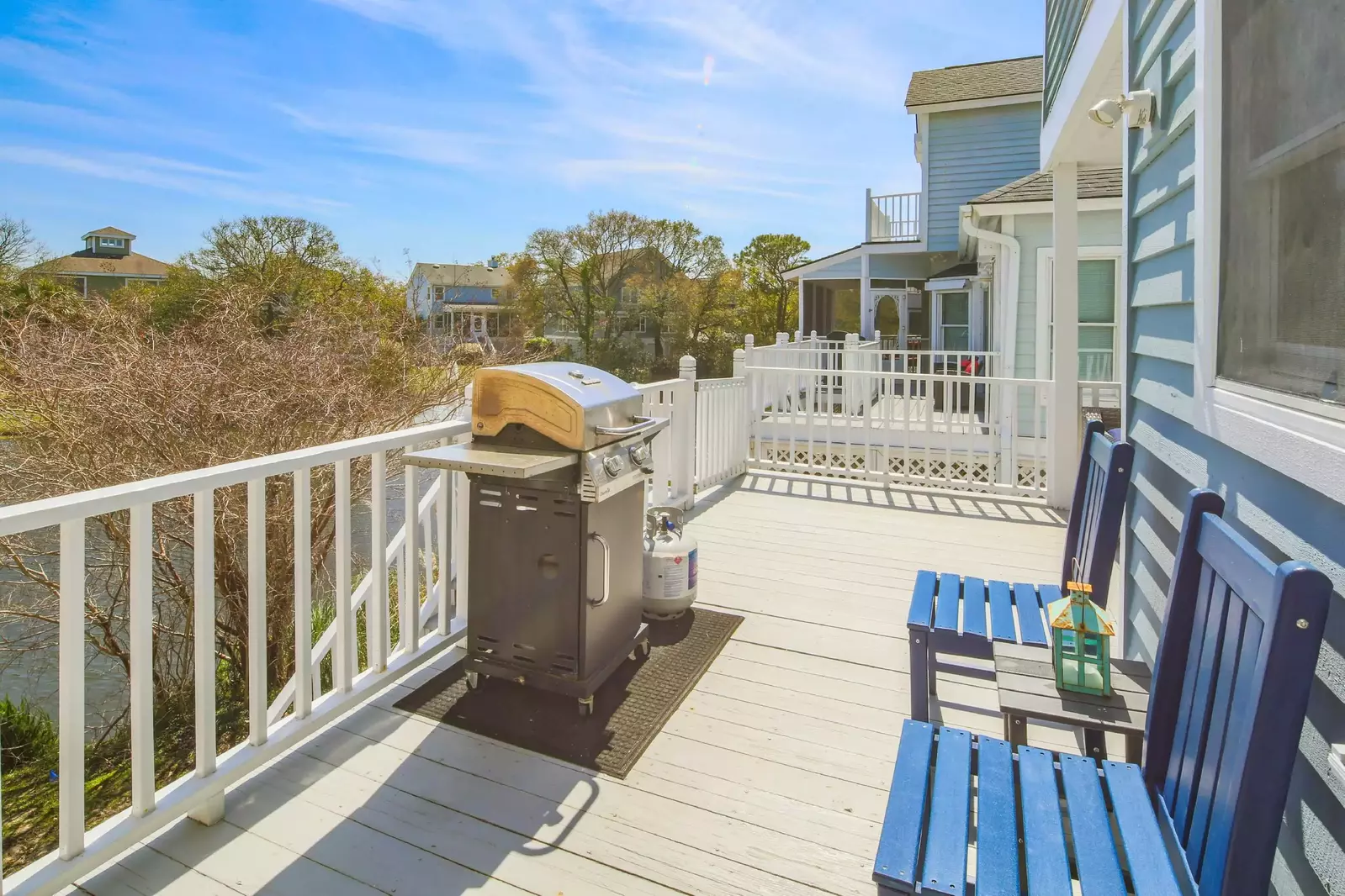 There is a gas BBQ grill located on the deck.