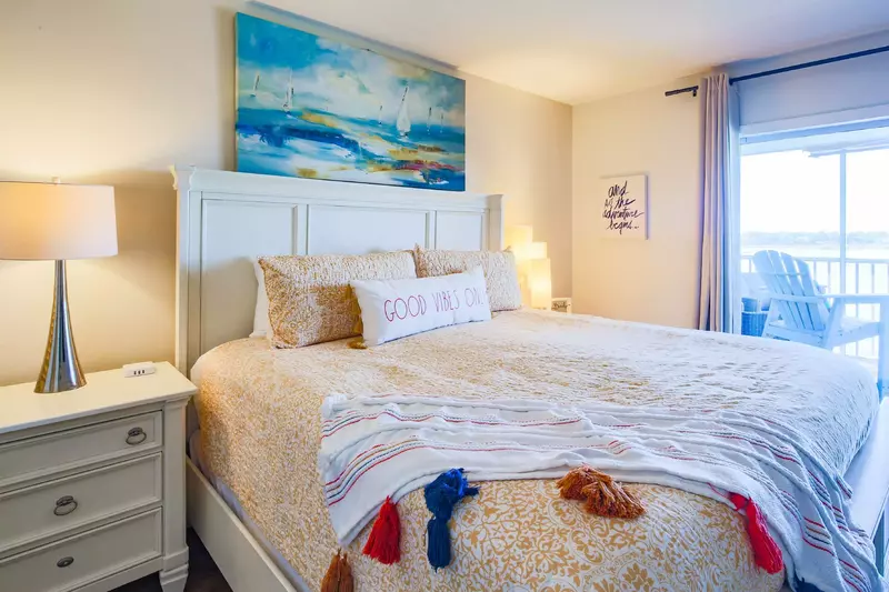 Both the master bedroom and living room feature terrific views of the Folly River.