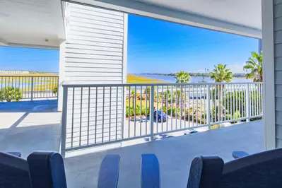 The seating area near the front door looks out onto the beautiful marsh on the front side of the building.