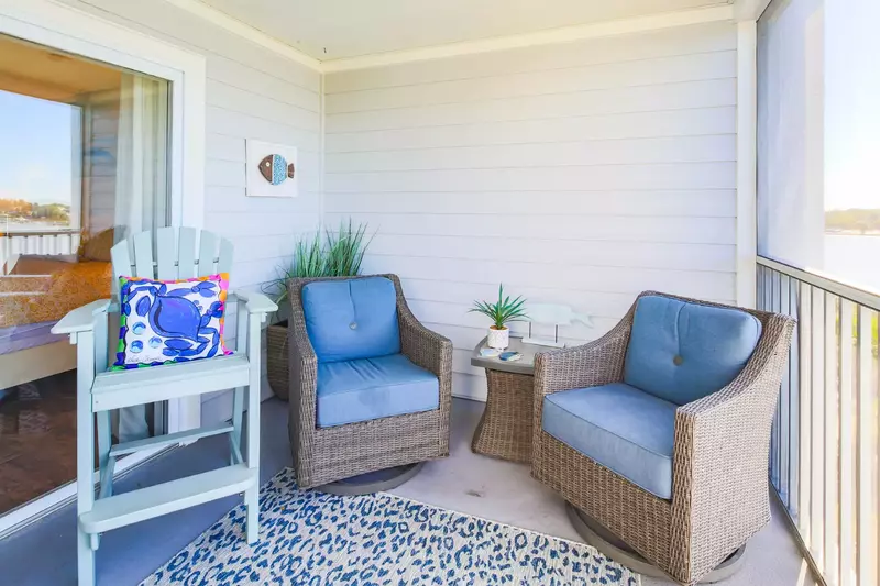 The screened patio can be accessed from both the living room and master bedroom.
