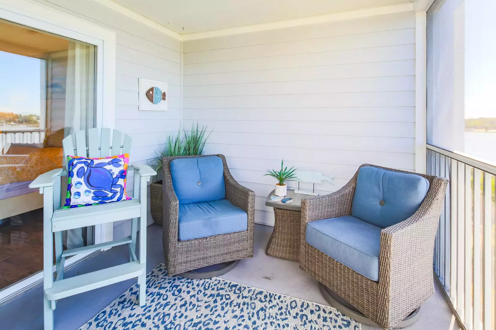 The screened patio can be accessed from both the living room and master bedroom.