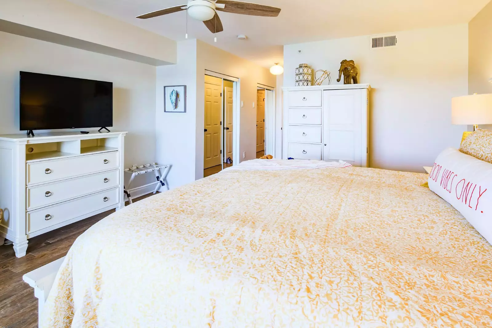 The master bedroom also has mirrored closets and an en suite bathroom.