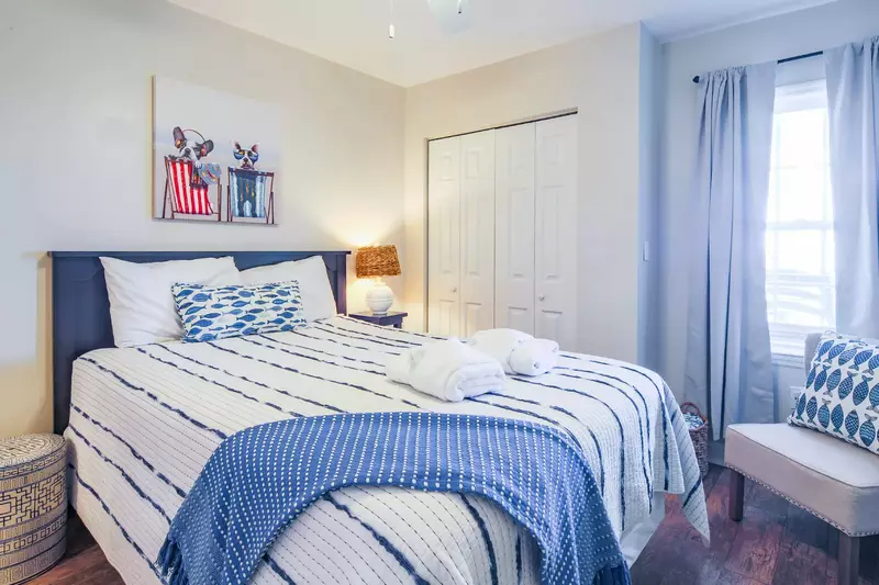 This guest bedroom is located off the hallway near the front door of the condo.
