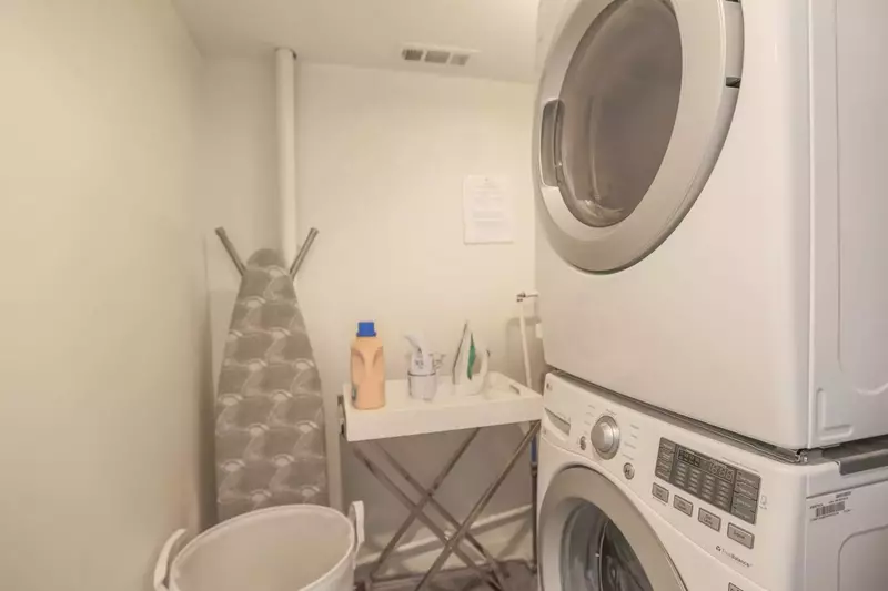 There is a laundry room with full sized washing machine and dryer in the condo.