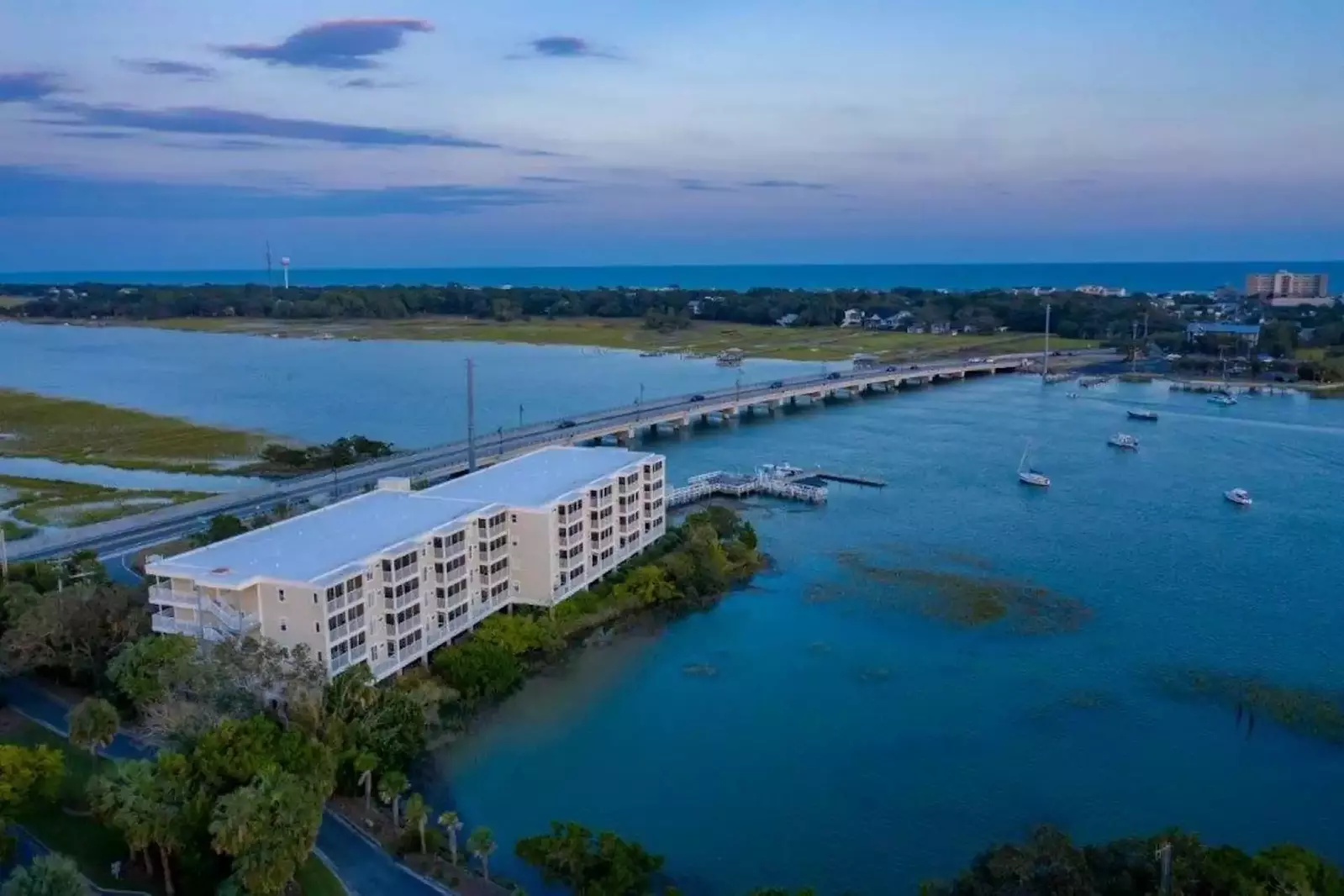 Hello Sunshine provides gorgeous views of the Folly River from its third floor location within the Turn of River building.