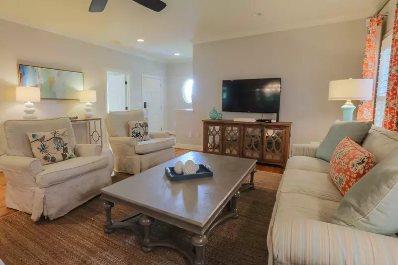 When you enter the front door, you'll find a great room with heart of pine wood floors, mounted large screen TV and comfortable seating.