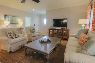 When you enter the front door, you'll find a great room with heart of pine wood floors, mounted large screen TV and comfortable seating.