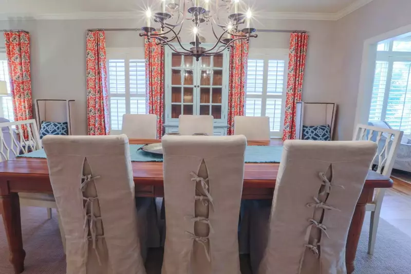 The dining room table comfortably seats 8 people.