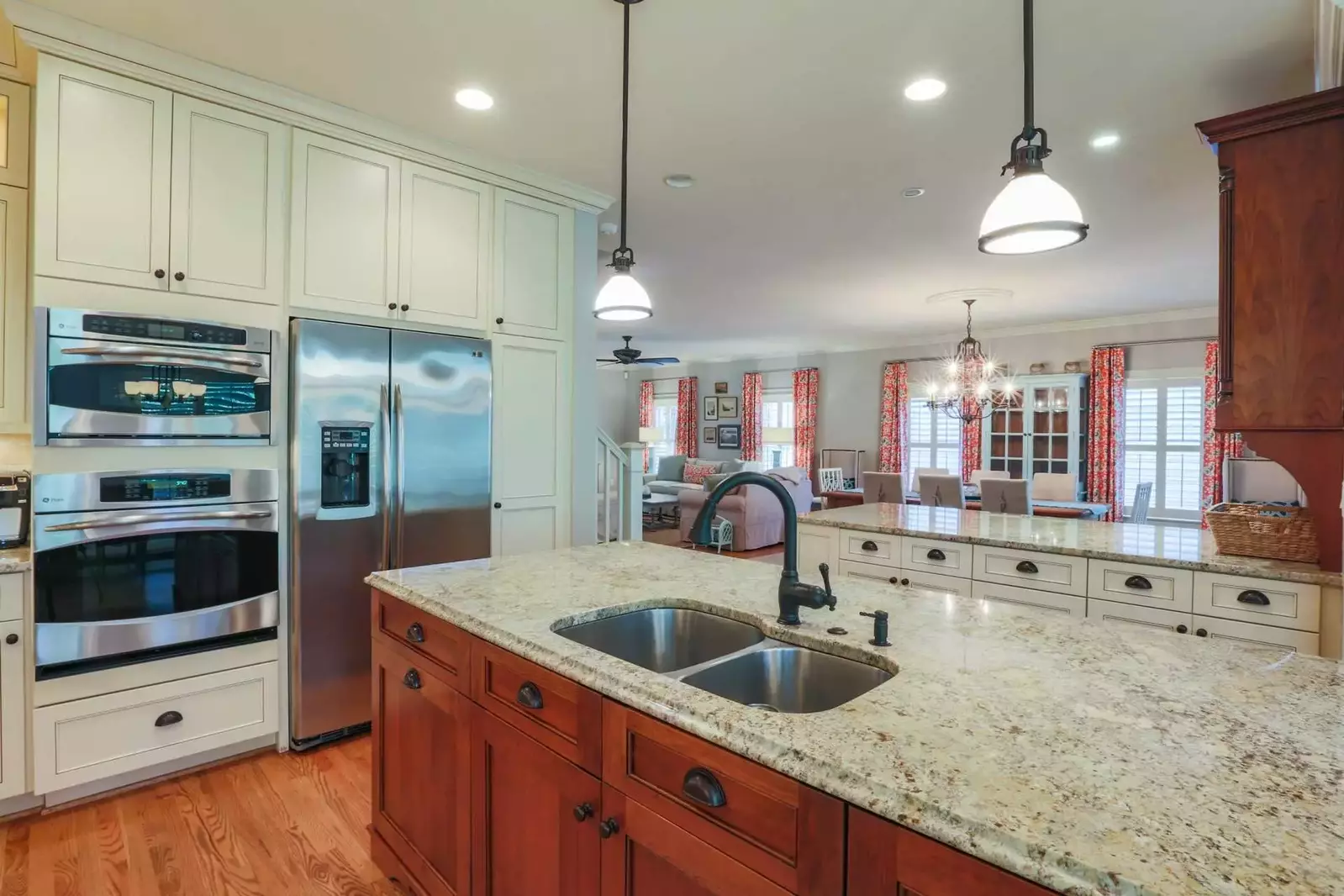 The home's open floor plan layout makes it very easy to interact with guests in the kitchen, dining room and living room areas.