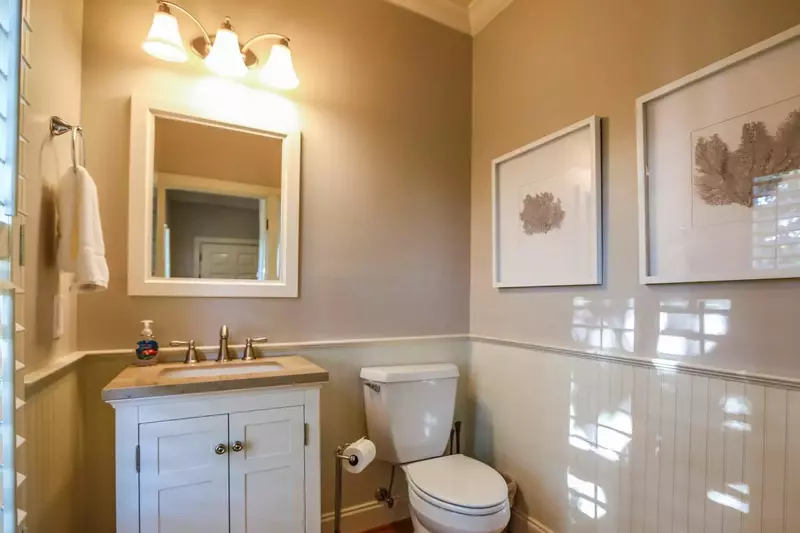 This half bathroom is located on the home's first floor.