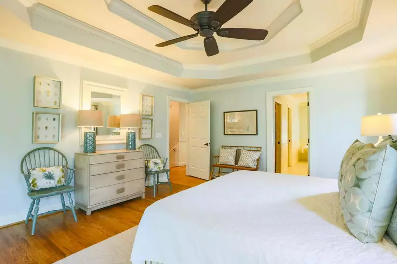 The master suite is located at the top of the stairs on the home's second floor.
