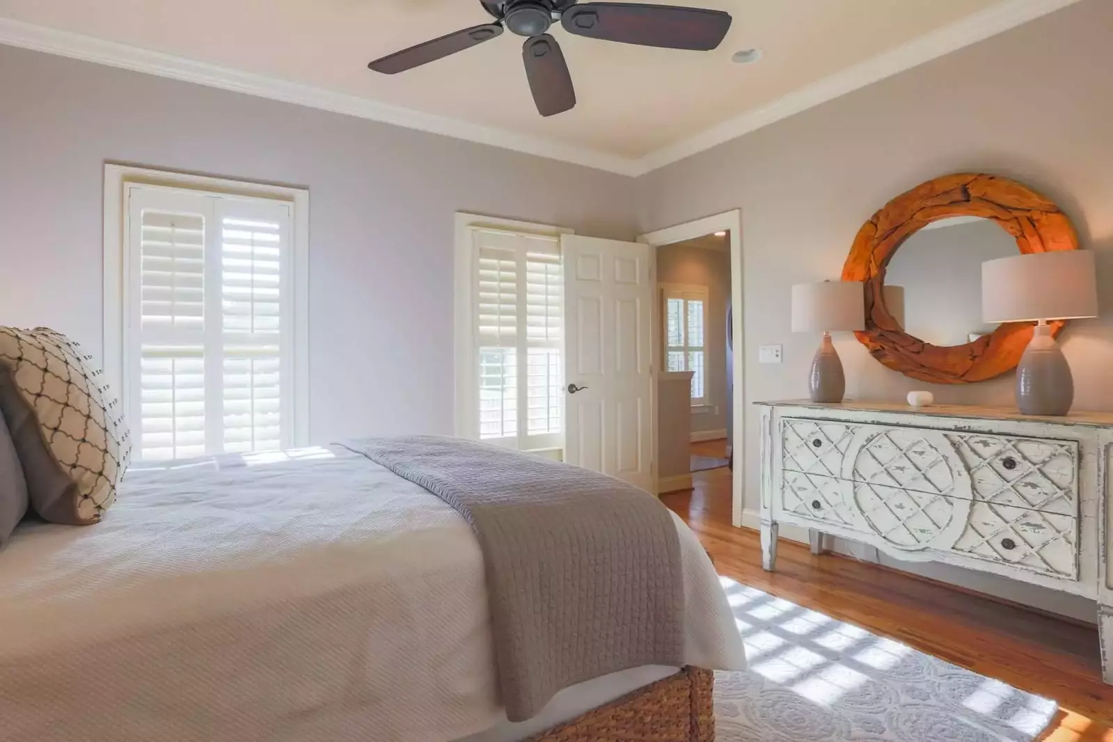 This guest bedroom is located on the home's first floor near the front door and living room.