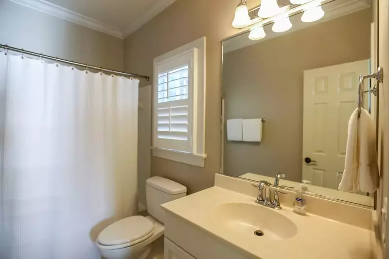The en suite bathroom has a shower/tub combo.