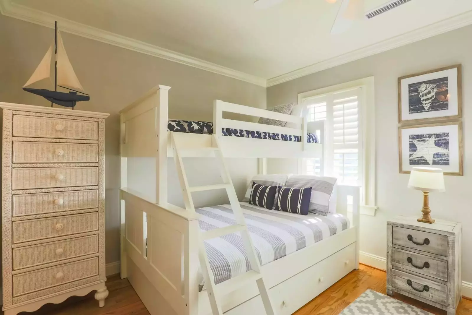 This bright & airy guest bedroom with two bunk beds is located on the home's second floor.