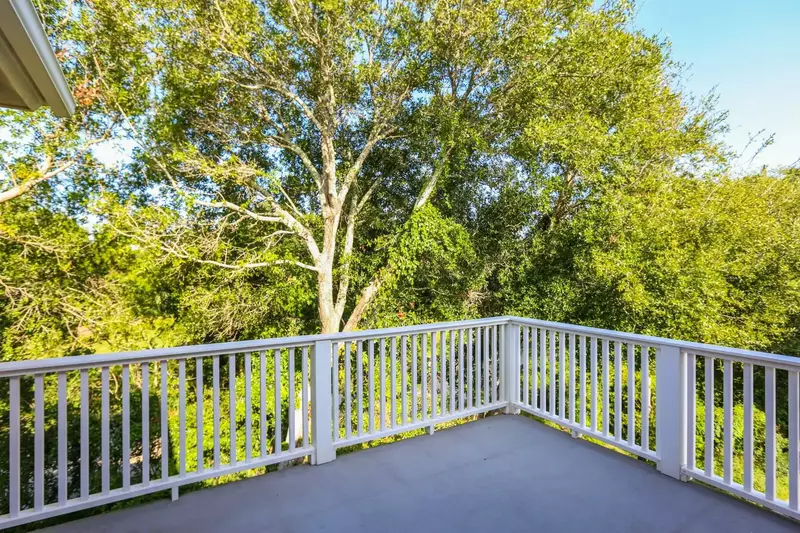 This back porch on the second floor connects to the master suite and one of the home's guest bedrooms.