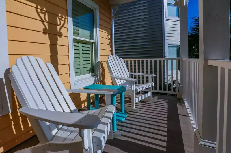 These Adirondack-style rocking chairs on the home's front porch greet you as you arrive.