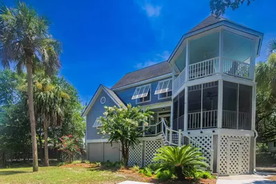 Rainbow Reef is an elevated, two-story beach house.