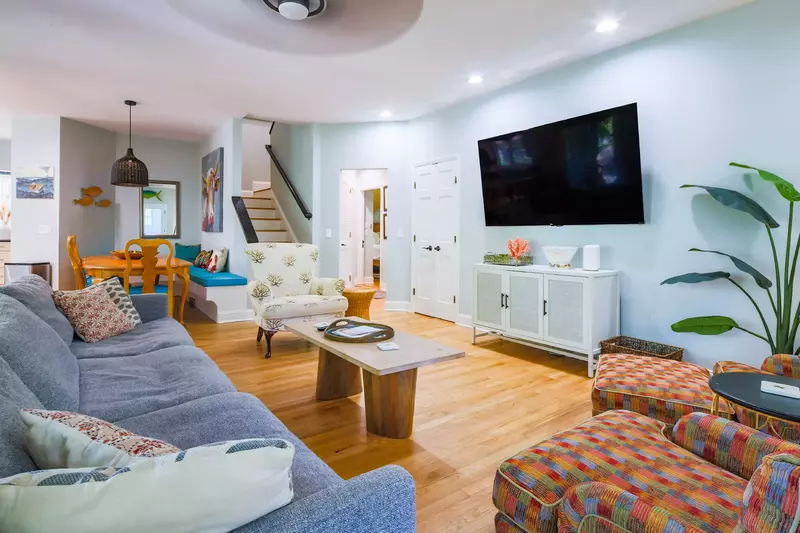 The living room flows into the dining area and kitchen.