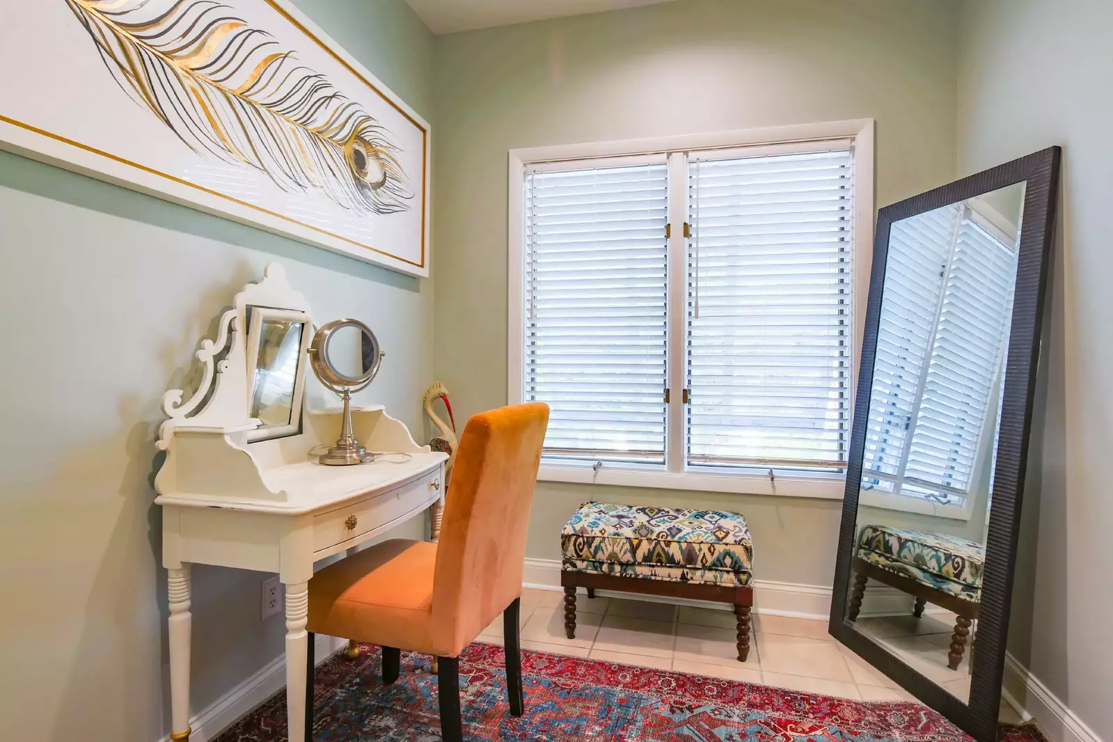 The primary suite features a make-up table and full-length mirror.