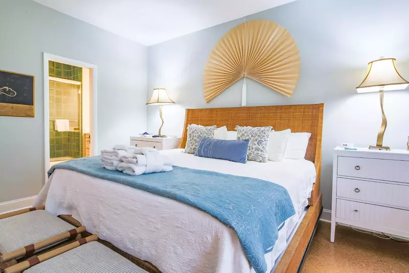 The en suite bathroom is located through the door on the left side of this photo.