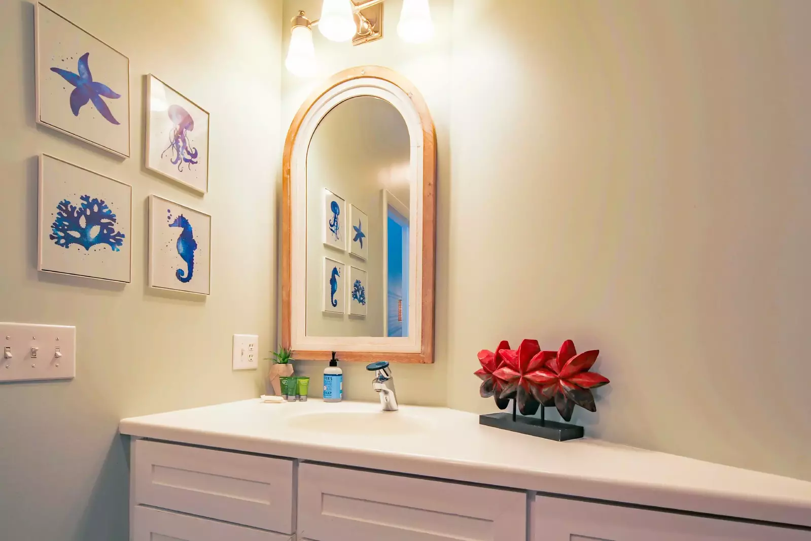 The Jack & Jill bathroom features a spacious vanity and fun wall art.