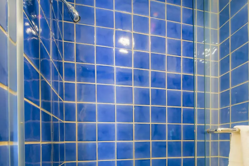 The Jack & Jill bathroom also has a tiled, shower/tub combo.