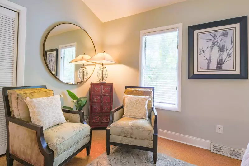 There is a seating area in the guest bedroom.