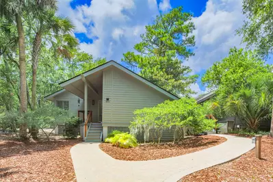 The left sidewalk takes you to the front door and the sidewalk on the right takes you to the back deck.