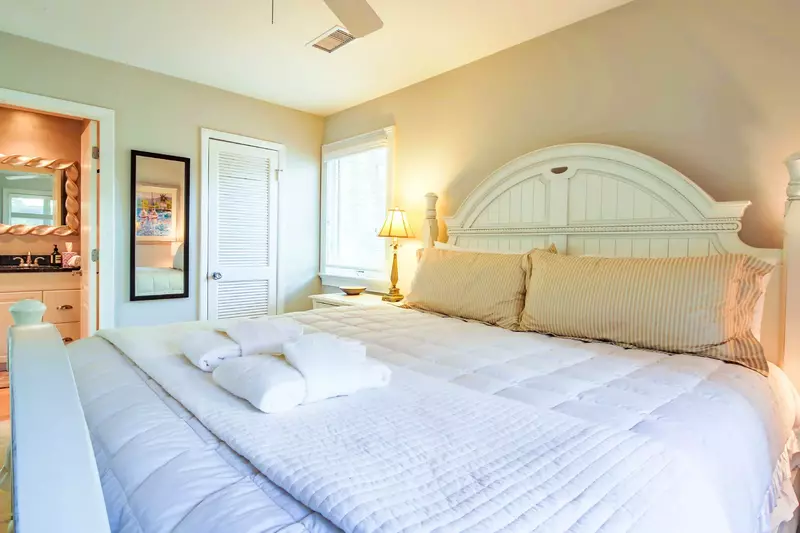 The en suite bathroom is located through the door on the left side of this photo.