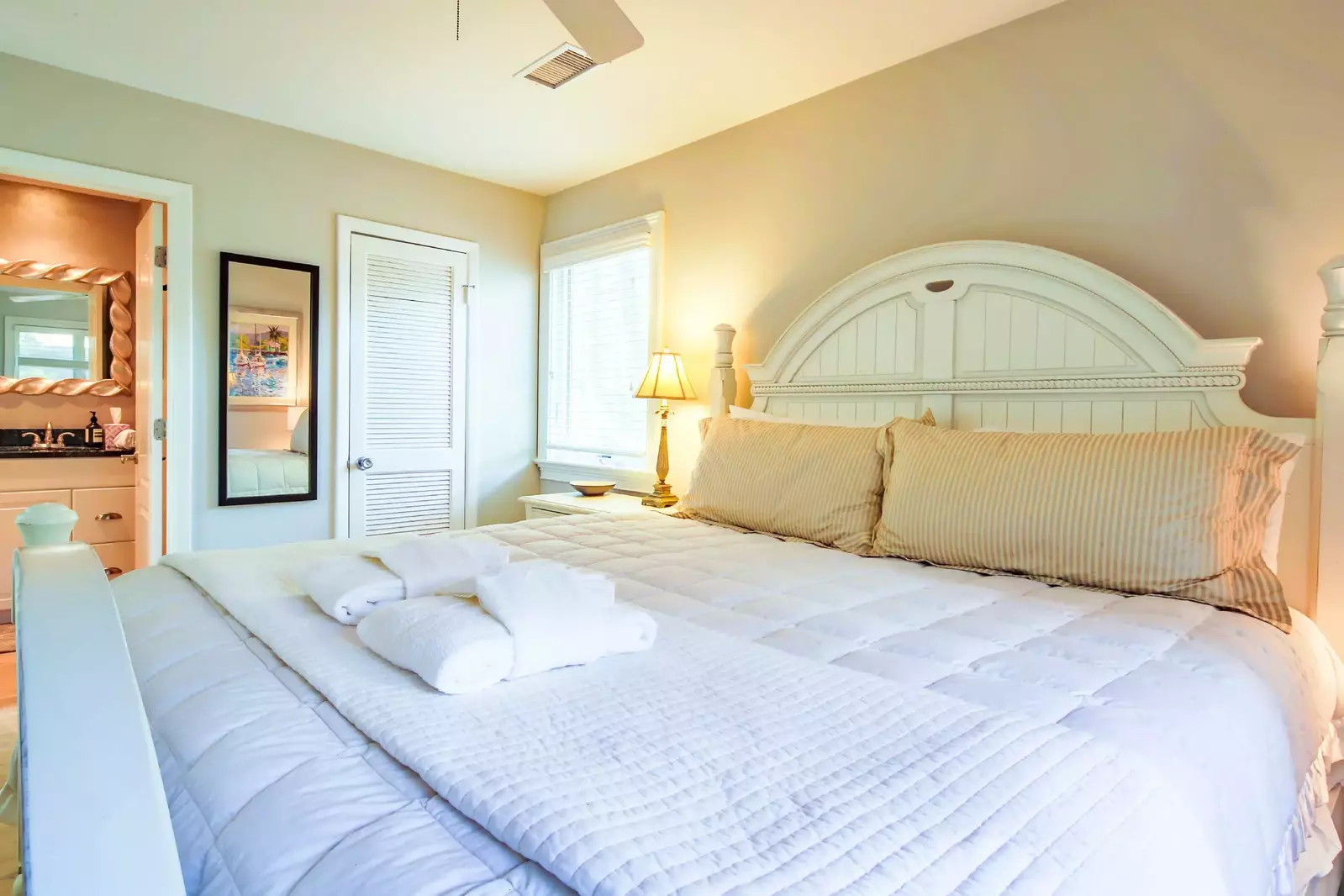The en suite bathroom is located through the door on the left side of this photo.