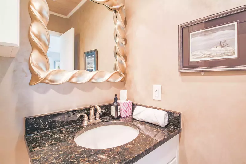 The en suite bathroom features a spacious vanity.