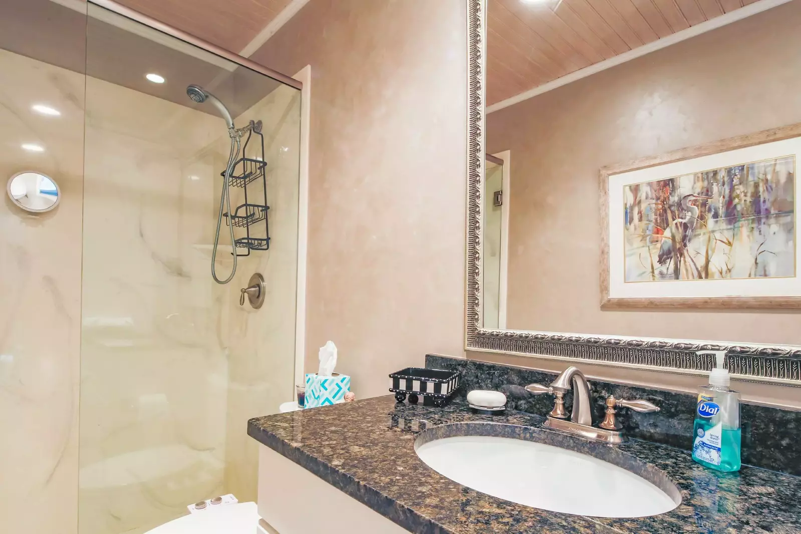 The two guest bedrooms share this beautiful hallway bathroom with a walk-in shower.