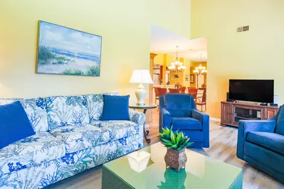 The living room also has a large screen TV.