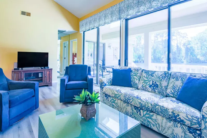 You can access the back deck via the sliding glass door in the living room (and the master suite).