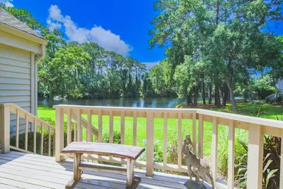 The back deck features peaceful lagoon views.
