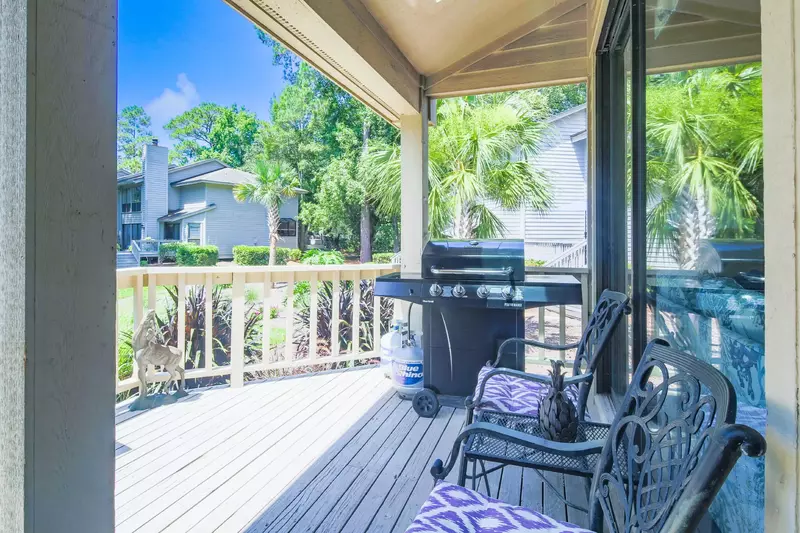 There is a seating area and gas BBQ grill on the back deck.