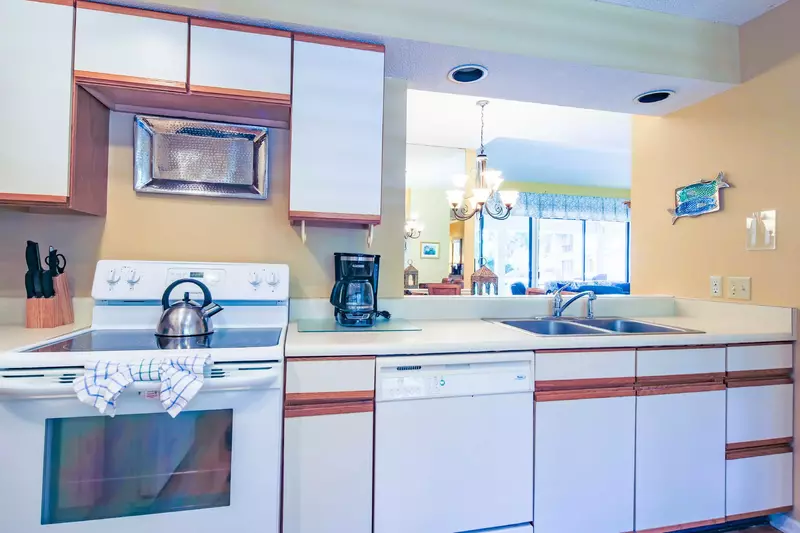 The kitchen opens into the dining area and living room.