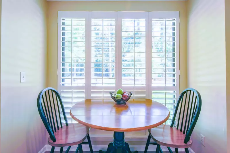 This table in the kitchen is the perfect spot for your morning coffee.