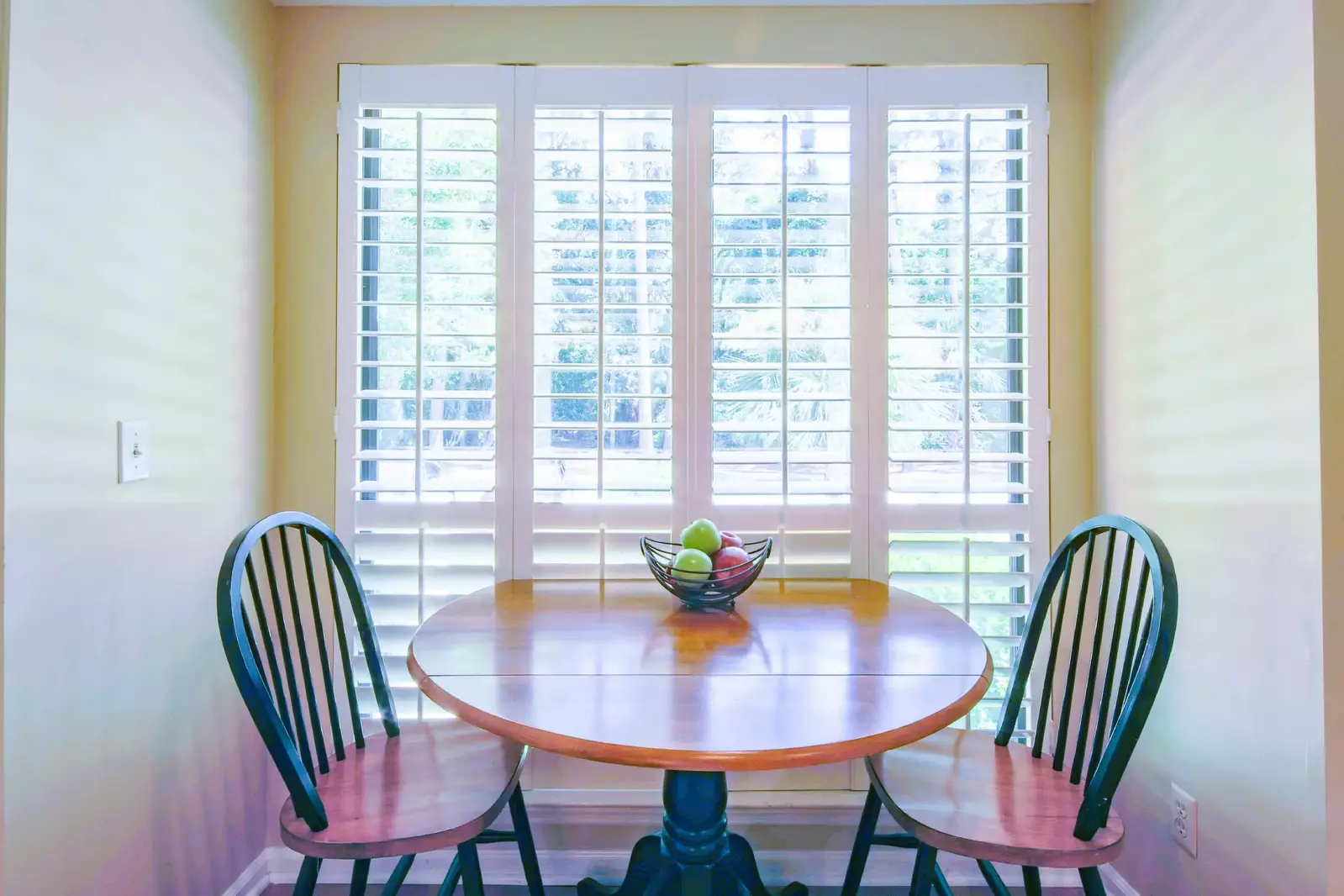 This table in the kitchen is the perfect spot for your morning coffee.