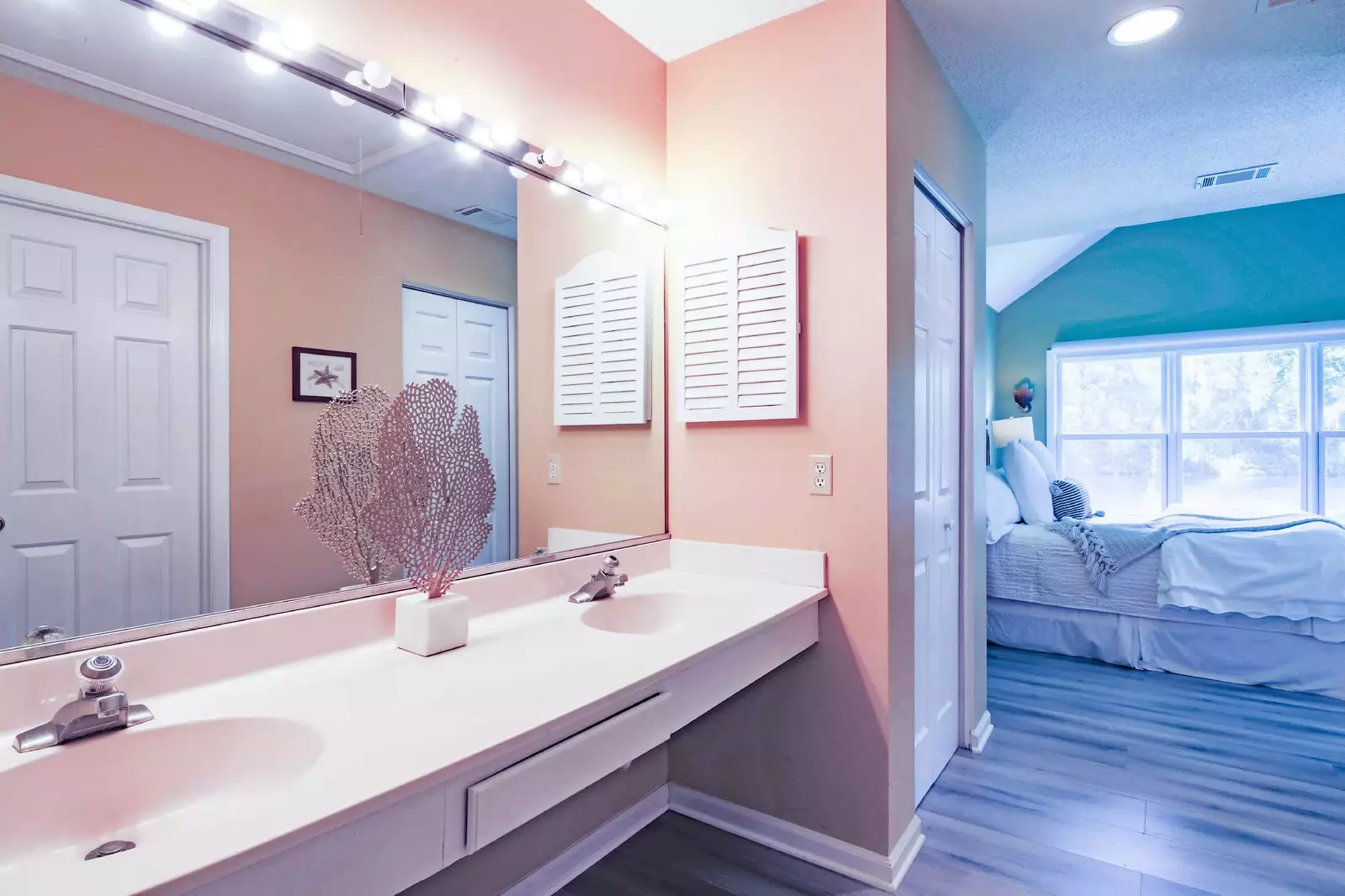 The en suite bathroom has a spacious, dual sink vanity.