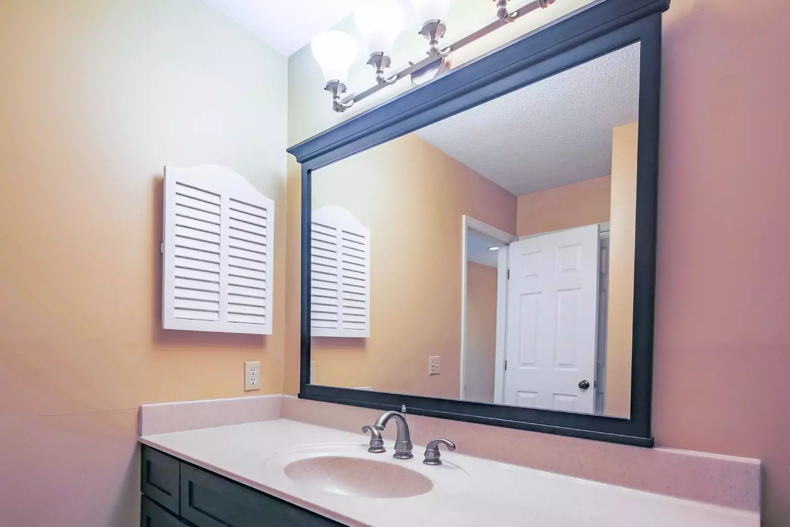 The guest bathroom features a spacious vanity.
