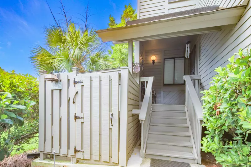Walk up these stairs to find the front door of Golf, Sea & Sunshine.