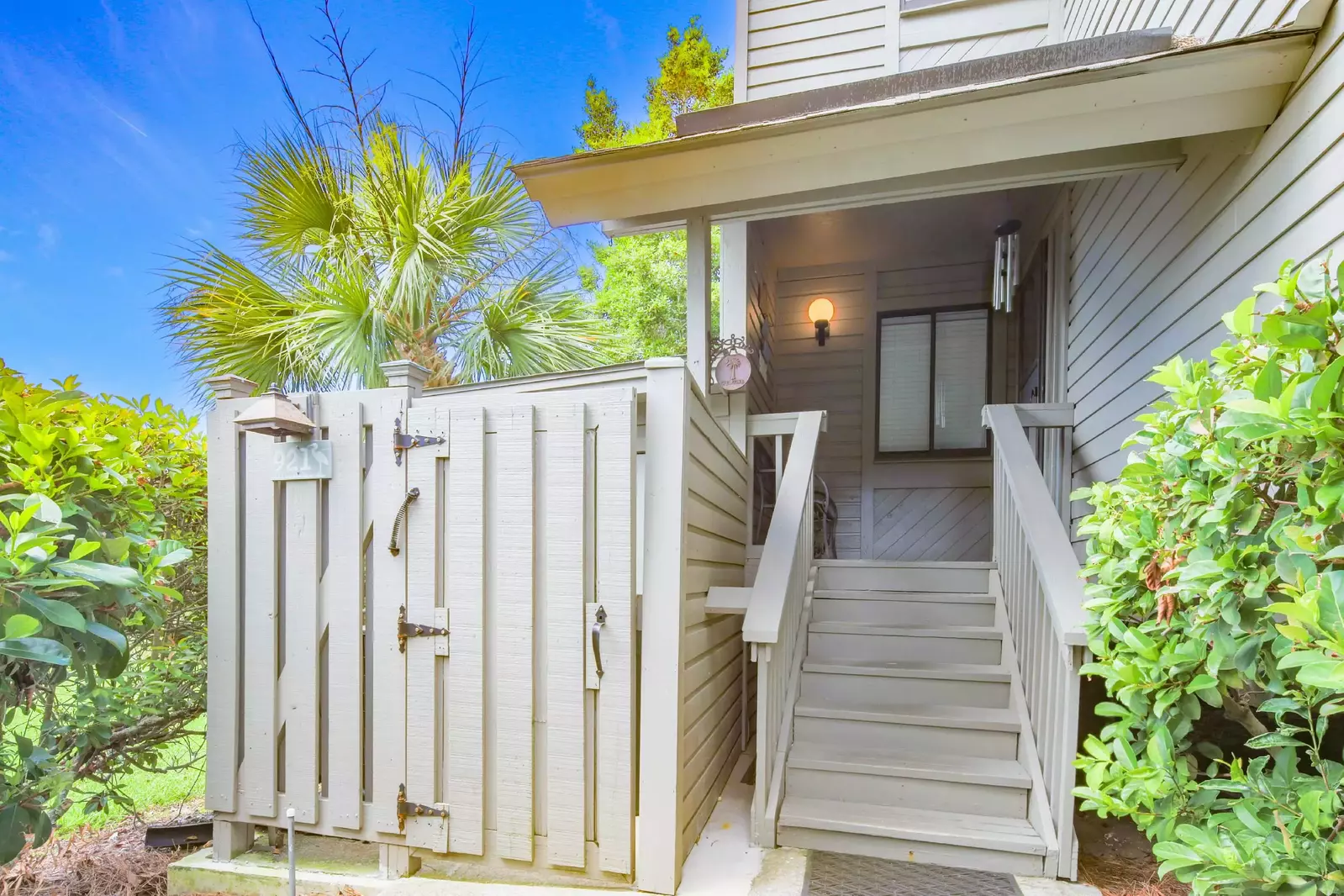 Walk up these stairs to find the front door of Golf, Sea & Sunshine.