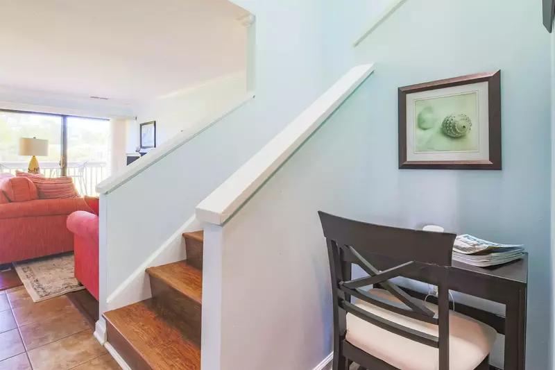 When you enter the front door, you'll find this desk, the stairwell to the second floor and the living room.