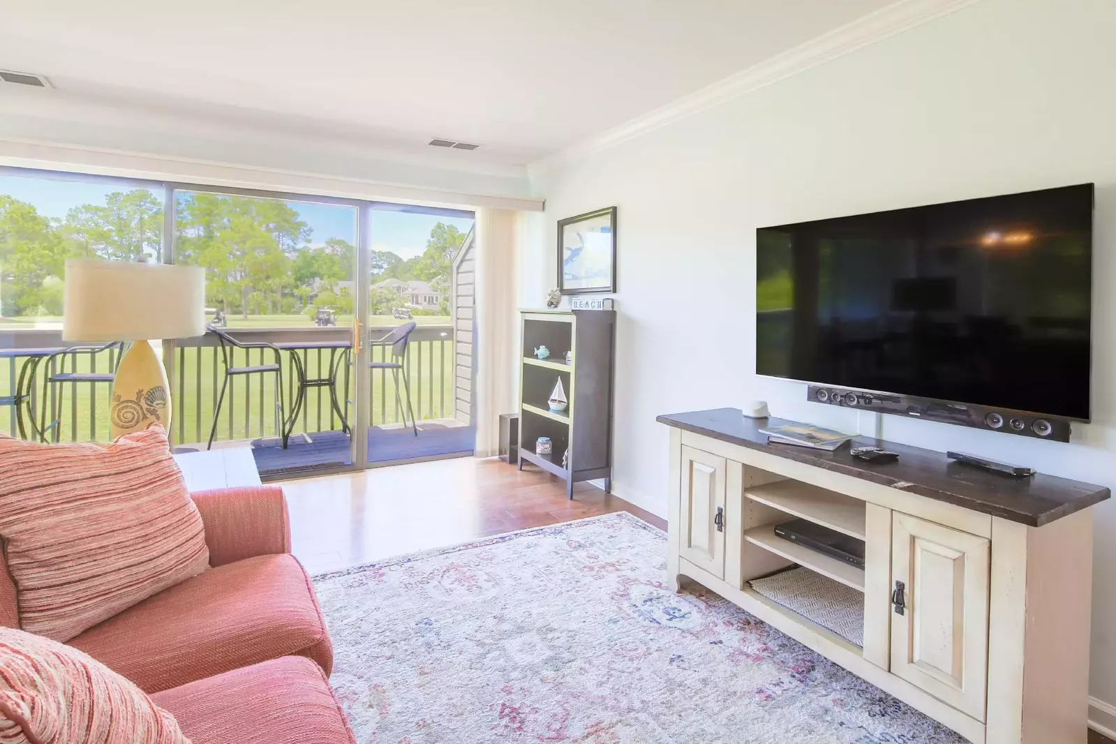 The living rooms receives wonderful natural light through the sliding glass doors.