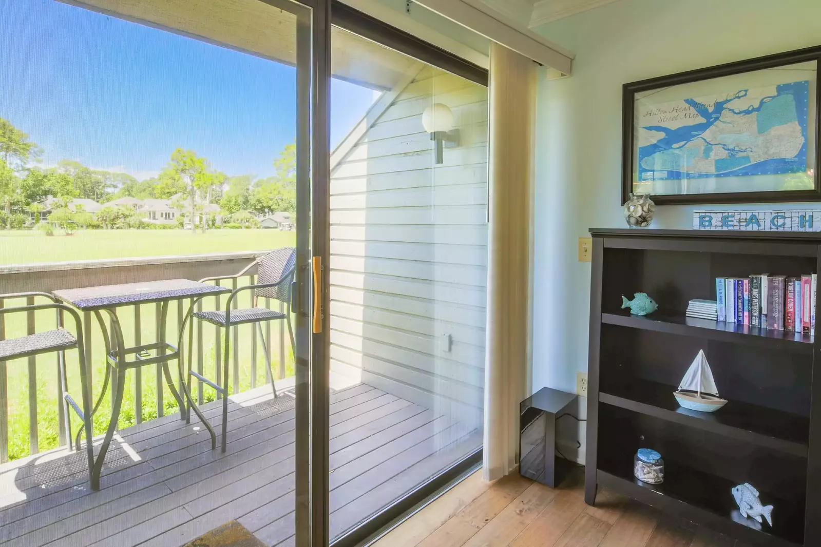 Open the sliding glass doors to access the partially-covered back deck.