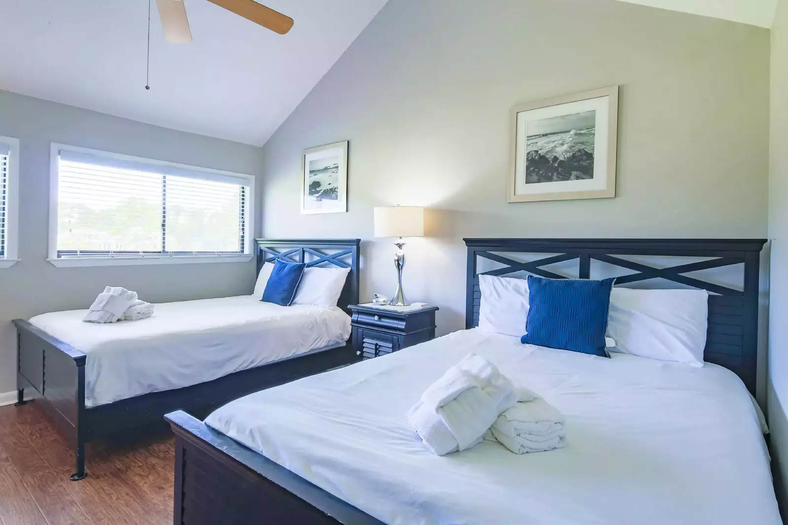 The master suite, which is located on the second floor, features two queen beds.