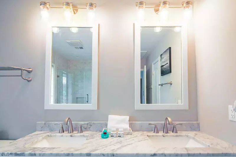 The en suite bathroom features a spacious, dual-sink vanity.