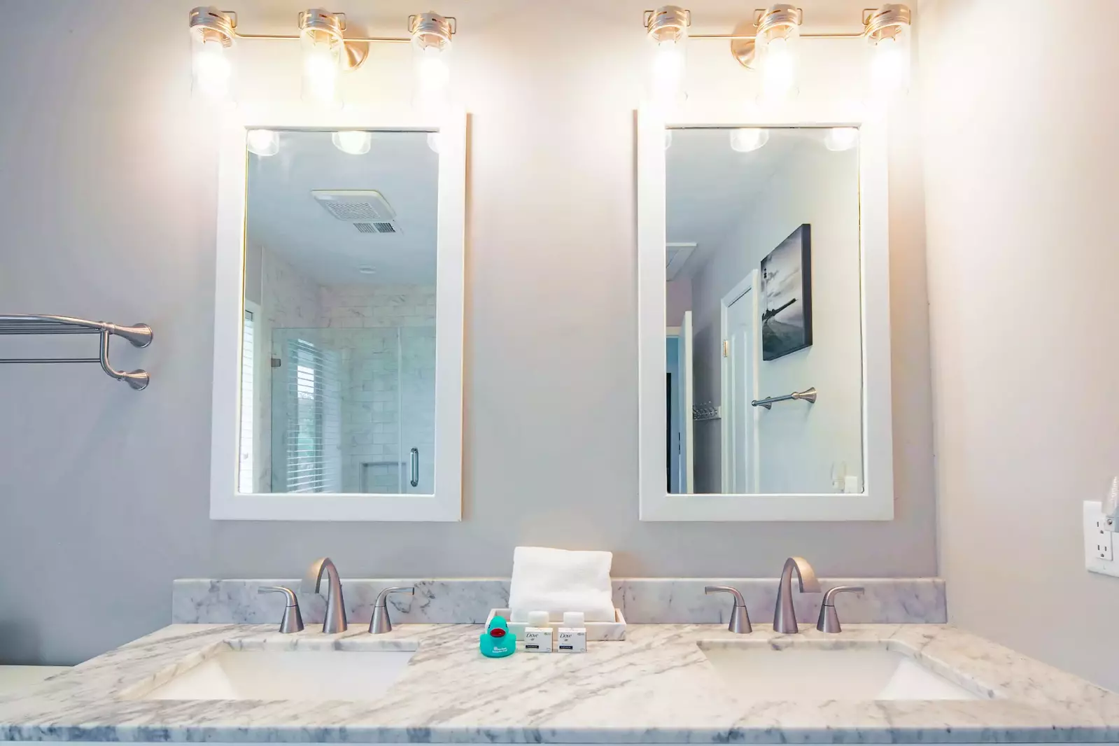 The en suite bathroom features a spacious, dual-sink vanity.