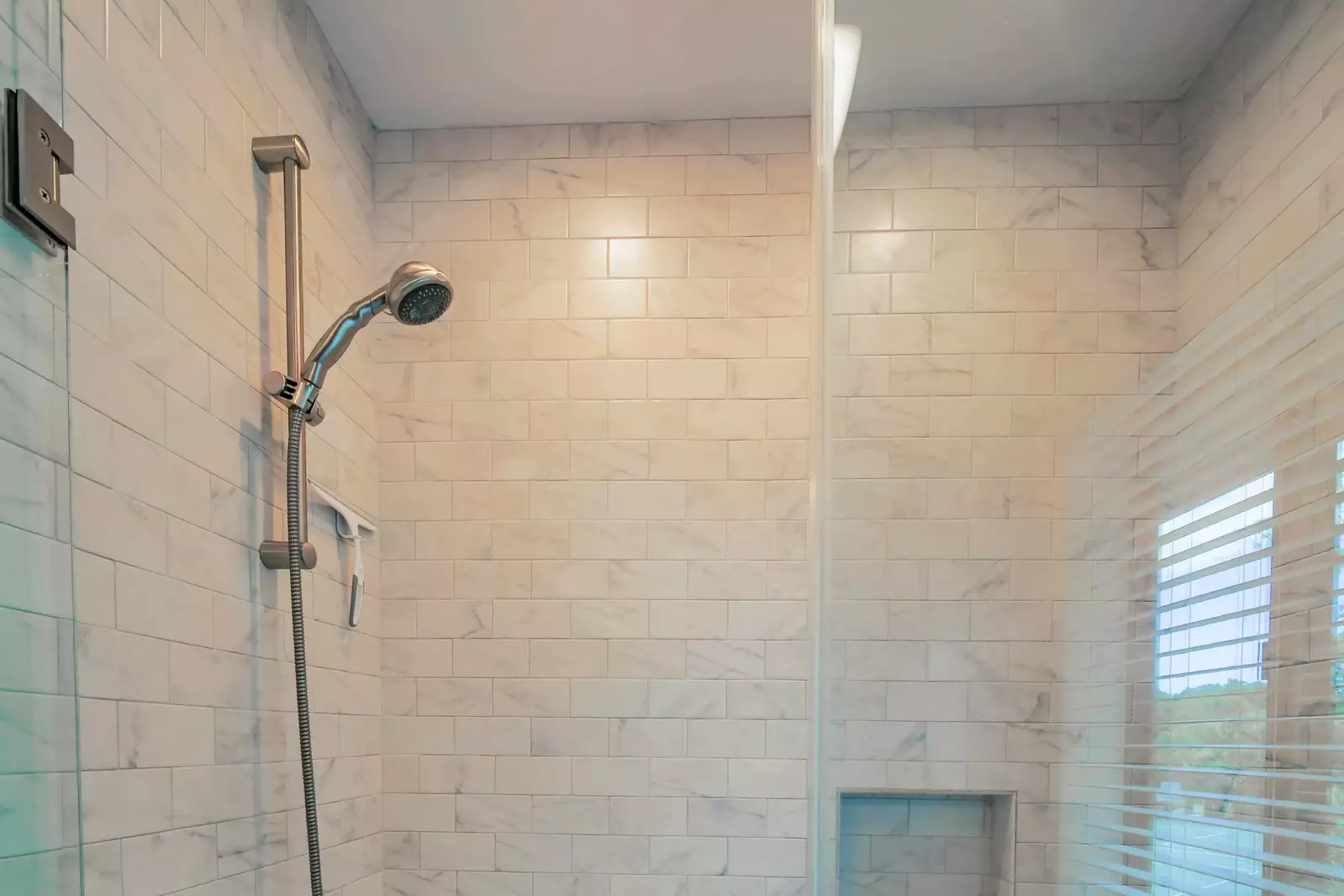 The en suite bathroom also has a tiled, shower/tub combo.